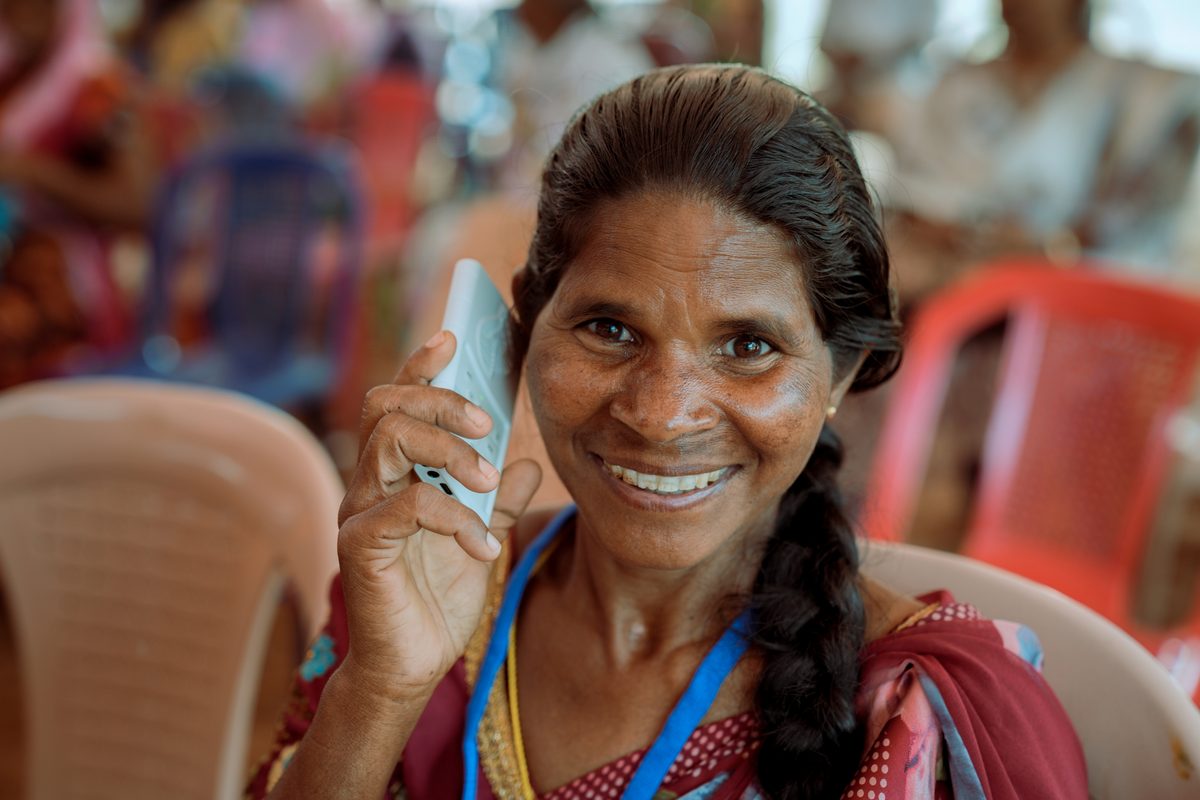 Woman listening to God's Word through the WCOI Audio Bible device